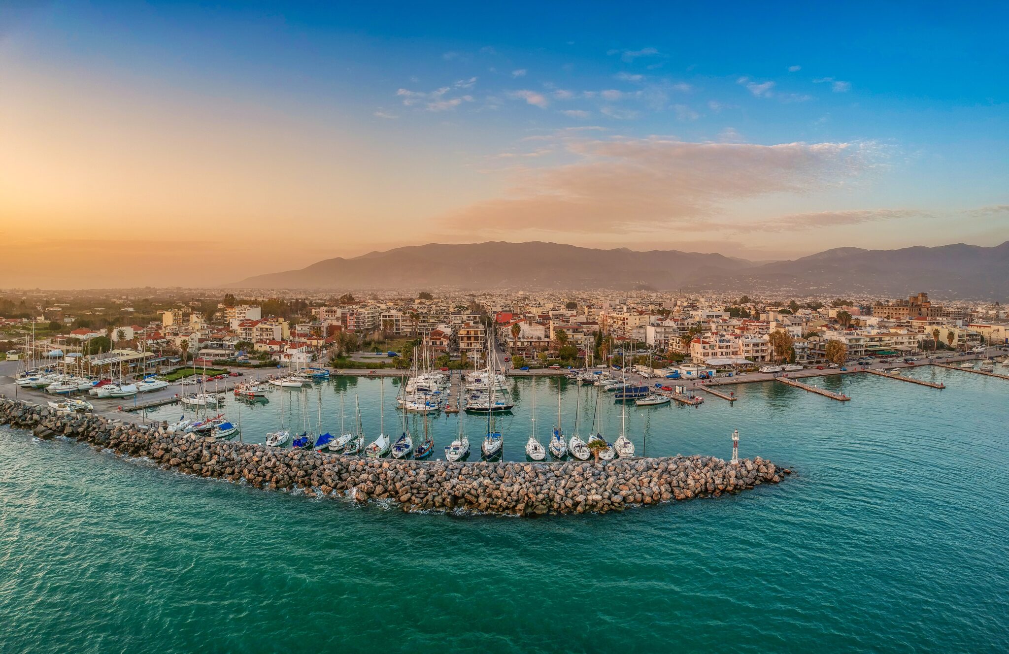 idyllic,landscape,flying,above,kalamata's,marina,at,sunset.,aerial,photography